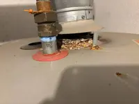 Corrosion at the top of a gas water heater tank in a Nampa, Idaho home