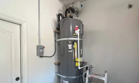 Technician installing a heat pump water heater in a Nampa, Idaho residential home