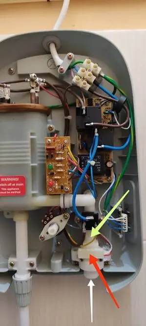 Homeowner checking a water heater with no hot water in a Nampa, Idaho home