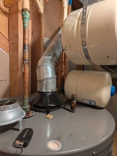 Older gas water heater installation requiring code-compliant venting in a Downtown Nampa, Idaho home